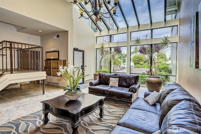 524 Maple St Unit 105, Edmonds, WA 98020 - living room featuring a towering ceiling, a chandelier, and a baseboard heating unit