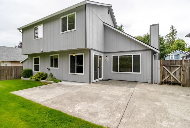 14626 58th Dr SE, Everett, WA 98208 - rear view of house featuring a patio and a chimney
