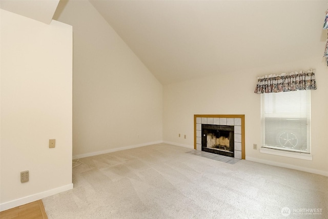 14626 58th Dr SE, Everett, WA 98208 - unfurnished living room with a tile fireplace, carpet floors, and lofted ceiling