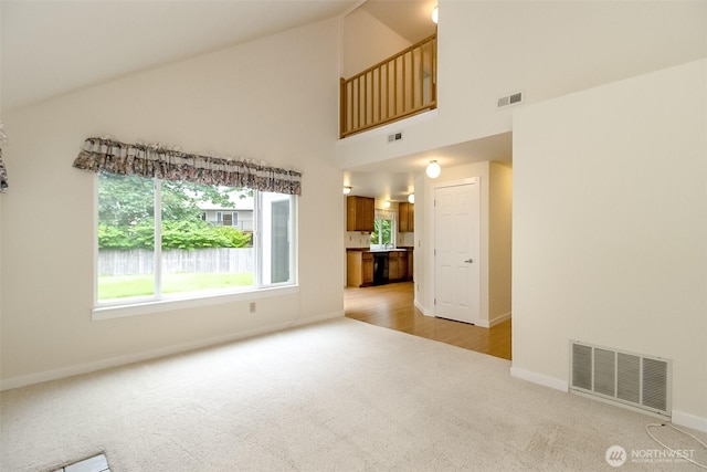 14626 58th Dr SE, Everett, WA 98208 - unfurnished living room with light carpet and high vaulted ceiling