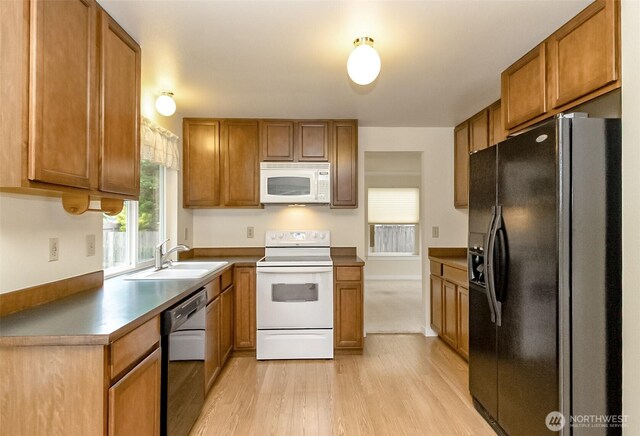 14626 58th Dr SE, Everett, WA 98208 - kitchen featuring white appliances, light wood finished floors, and brown cabinetry