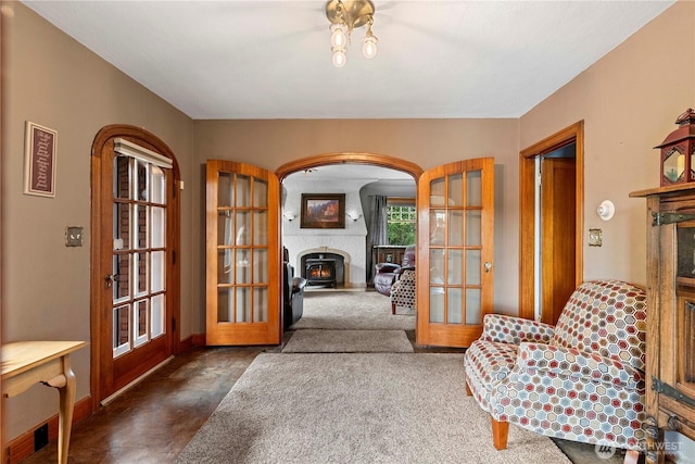 2020 Easy St, Wenatchee, WA 98801 - sitting room with french doors, a large fireplace, arched walkways, and finished concrete floors