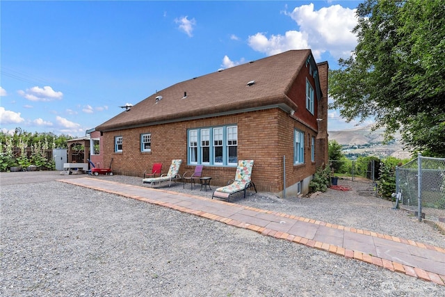 2020 Easy St, Wenatchee, WA 98801 - rear view of house with brick siding and roof with shingles