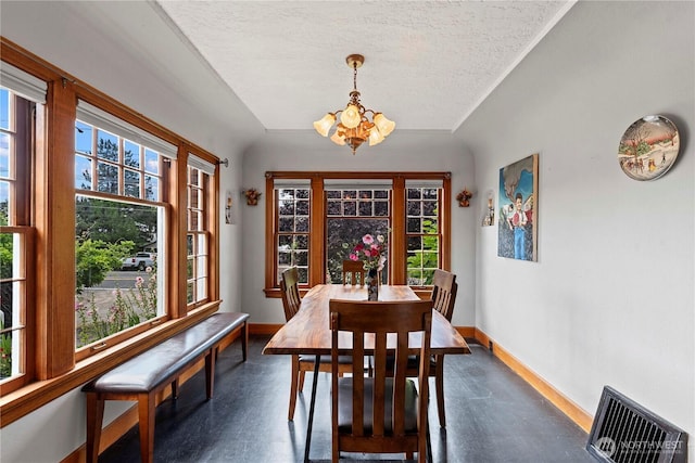 2020 Easy St, Wenatchee, WA 98801 - dining room featuring a chandelier, a textured ceiling, and concrete floors