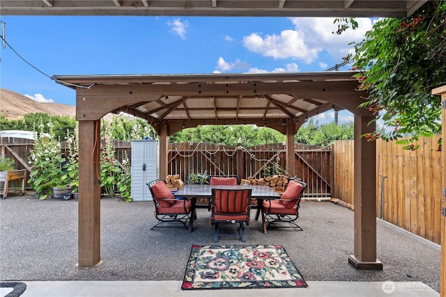 2020 Easy St, Wenatchee, WA 98801 - fenced backyard featuring a gazebo, outdoor dining space, a patio area, and a mountain view