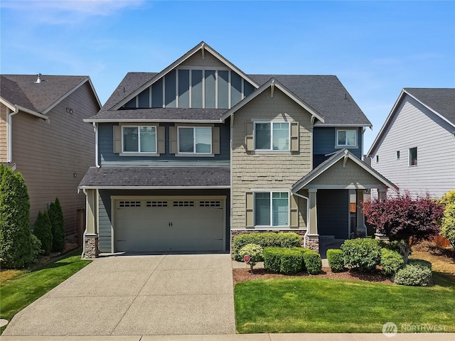 535 Beechwood Ct SW, Olympia, WA 98502 - craftsman house with driveway, a shingled roof, a garage, stone siding, and a front yard