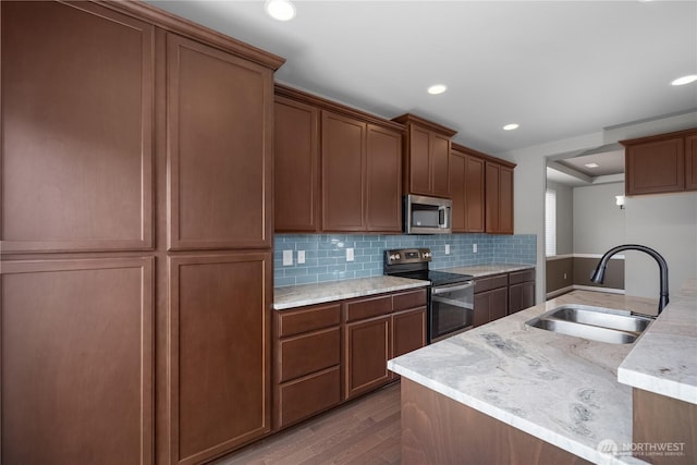 535 Beechwood Ct SW, Olympia, WA 98502 - kitchen with stainless steel appliances, wood finished floors, backsplash, and recessed lighting