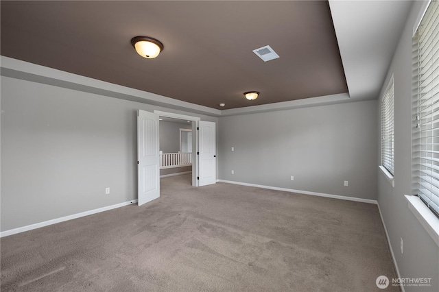535 Beechwood Ct SW, Olympia, WA 98502 - carpeted spare room featuring baseboards and a tray ceiling