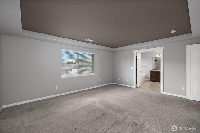 535 Beechwood Ct SW, Olympia, WA 98502 - unfurnished bedroom with a raised ceiling, carpet, and ensuite bath