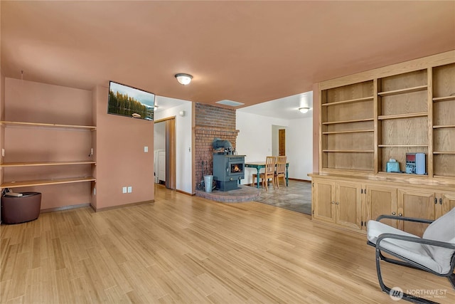 11022 SE 313th St, Auburn, WA 98092 - living room with a wood stove and light wood-type flooring