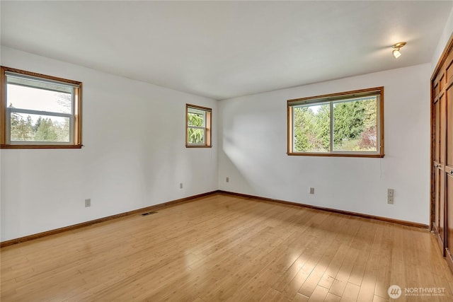 11022 SE 313th St, Auburn, WA 98092 - unfurnished room with baseboards and light wood-style flooring