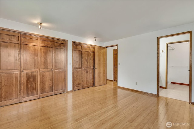 11022 SE 313th St, Auburn, WA 98092 - unfurnished bedroom with two closets and light wood-style floors