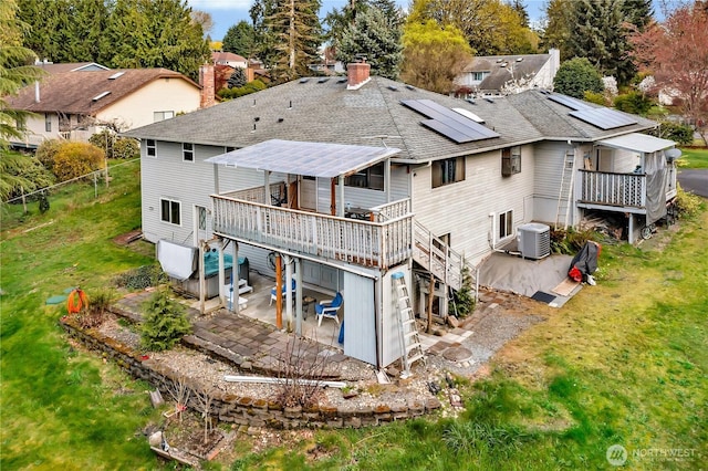 11022 SE 313th St, Auburn, WA 98092 - back of property with a patio area, a wooden deck, a shingled roof, and a chimney