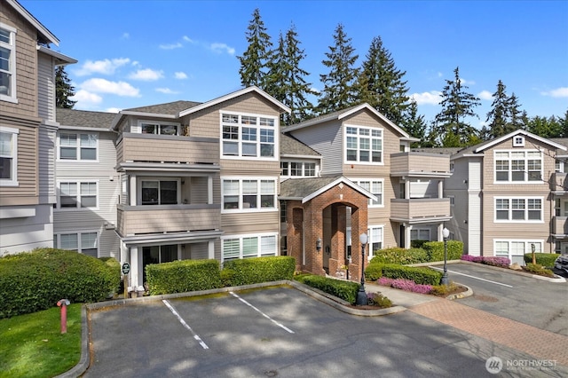 8500 Main St Unit F205, Edmonds, WA 98026 - view of property with uncovered parking and a residential view