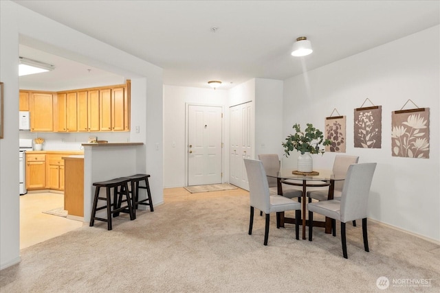 8500 Main St Unit F205, Edmonds, WA 98026 - dining area with light colored carpet and baseboards