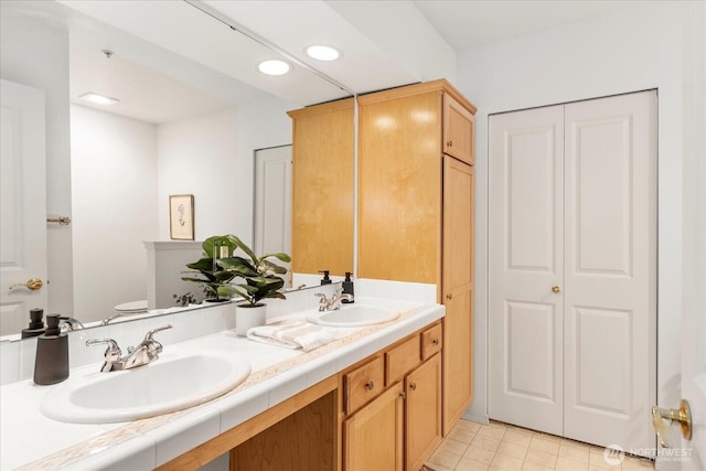 8500 Main St Unit F205, Edmonds, WA 98026 - bathroom with a closet, double vanity, and recessed lighting