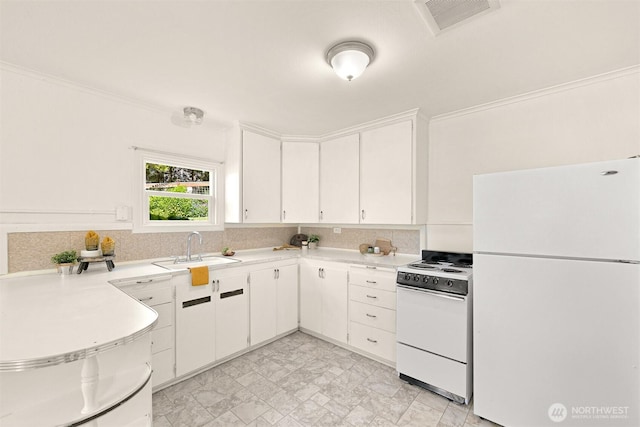 251 N Garden St, Bellingham, WA 98225 - kitchen with white appliances, light countertops, white cabinetry, and backsplash