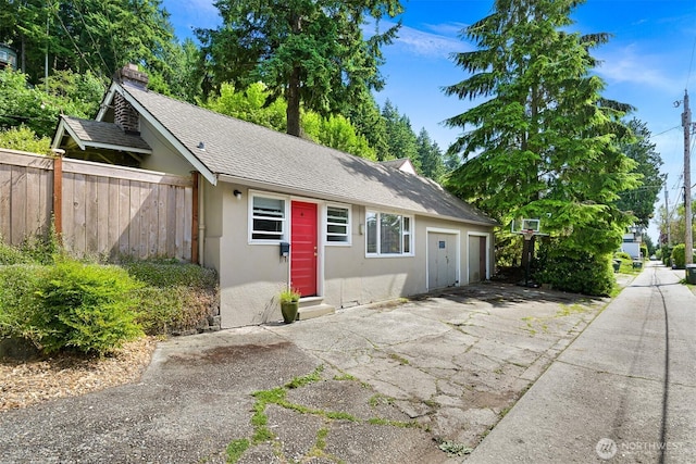 251 N Garden St, Bellingham, WA 98225 - view of front of property with stucco siding, a garage, asphalt driveway, and a shingled roof