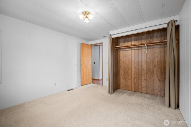 8265 Skeena Way, Blaine, WA 98230 - unfurnished bedroom with carpet floors, a closet, and wooden walls