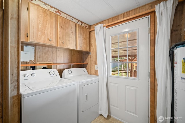 8265 Skeena Way, Blaine, WA 98230 - laundry room with washer and clothes dryer, cabinet space, water heater, and wooden walls