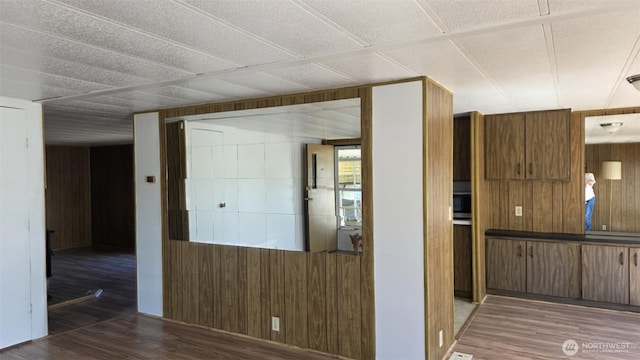 511 Leisure Cir, Aberdeen, WA 98520 - hall with wooden walls and wood finished floors