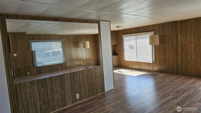 511 Leisure Cir, Aberdeen, WA 98520 - unfurnished room with wooden walls, healthy amount of natural light, and wood finished floors