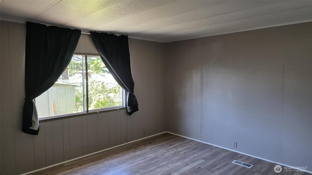 511 Leisure Cir, Aberdeen, WA 98520 - empty room with wood finished floors and wood walls