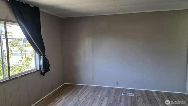 511 Leisure Cir, Aberdeen, WA 98520 - spare room featuring wood finished floors and wood walls