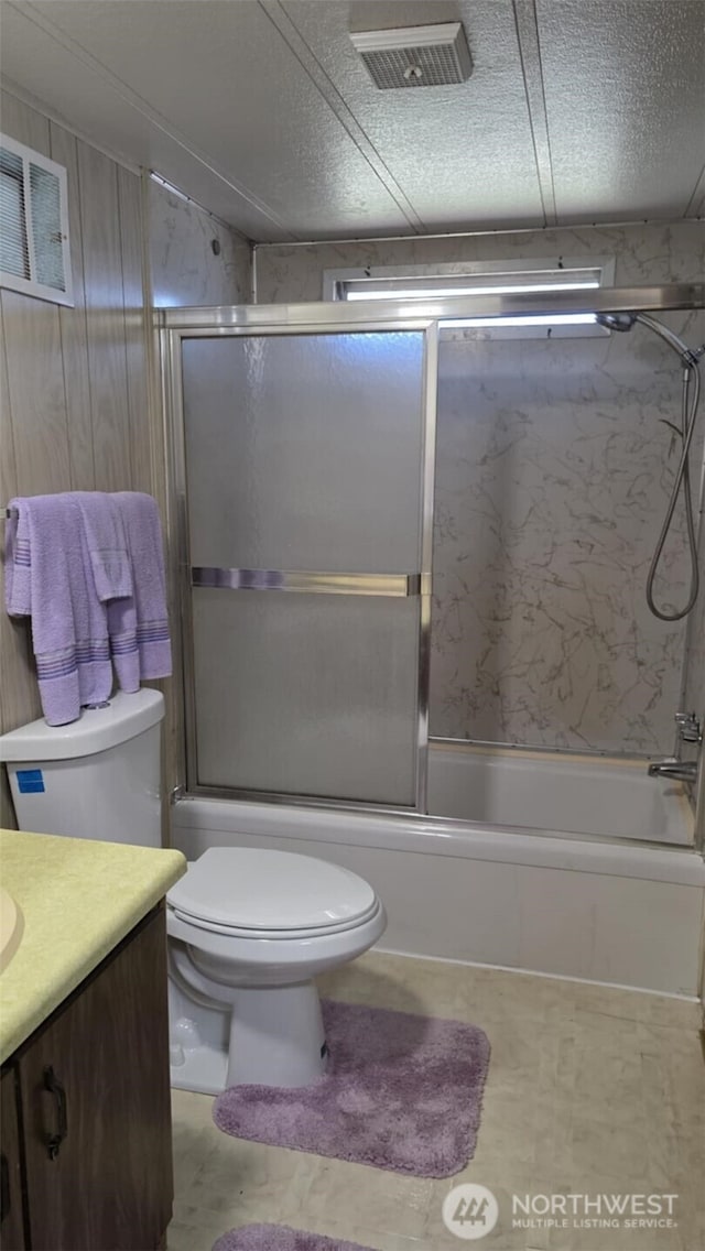 511 Leisure Cir, Aberdeen, WA 98520 - bathroom with vanity, combined bath / shower with glass door, and a textured ceiling