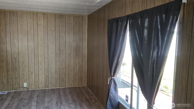 511 Leisure Cir, Aberdeen, WA 98520 - spare room with wood walls and wood finished floors