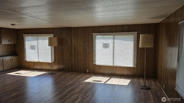 511 Leisure Cir, Aberdeen, WA 98520 - empty room with wood finished floors, healthy amount of natural light, and wooden walls