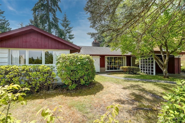 10629 NE 26th St, Bellevue, WA 98004 - rear view of property with a lawn and a chimney