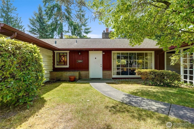 10629 NE 26th St, Bellevue, WA 98004 - single story home with a chimney, a front yard, and roof with shingles