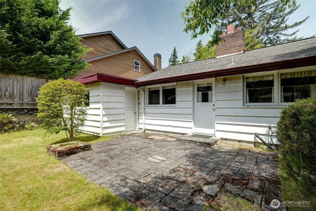 10629 NE 26th St, Bellevue, WA 98004 - rear view of property featuring a patio and a chimney