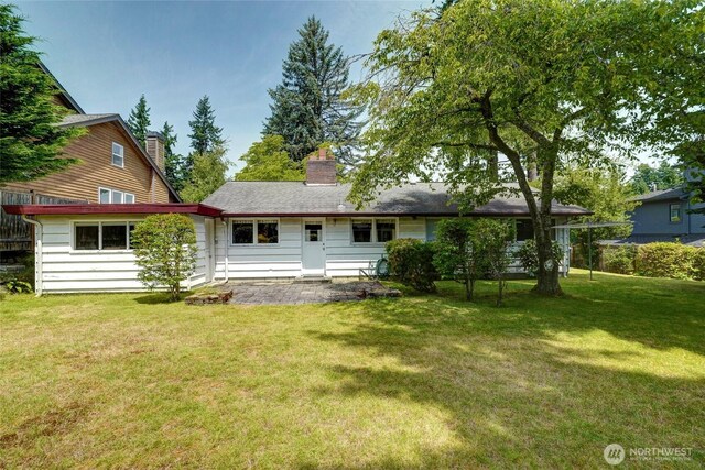10629 NE 26th St, Bellevue, WA 98004 - back of property featuring a yard and a patio