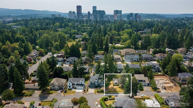 10629 NE 26th St, Bellevue, WA 98004 - aerial view of property and surrounding area with property parcel outlined and nearby suburban area