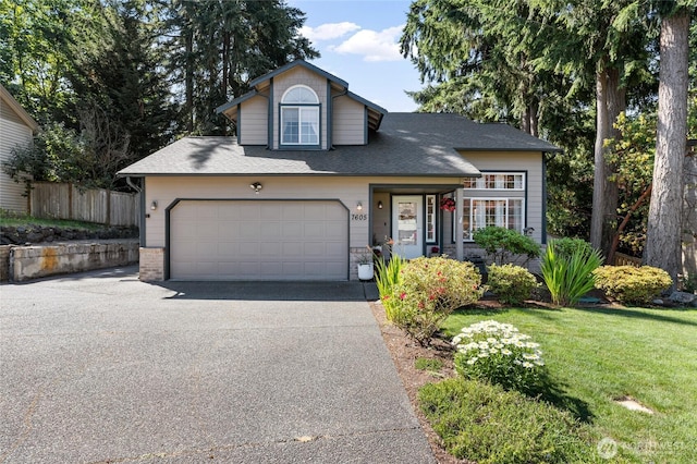 7605 38th Ct SE, Lacey, WA 98503 - view of front facade featuring asphalt driveway, roof with shingles, and an attached garage