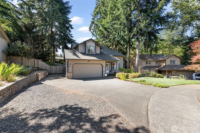 7605 38th Ct SE, Lacey, WA 98503 - traditional home with asphalt driveway, an attached garage, and brick siding