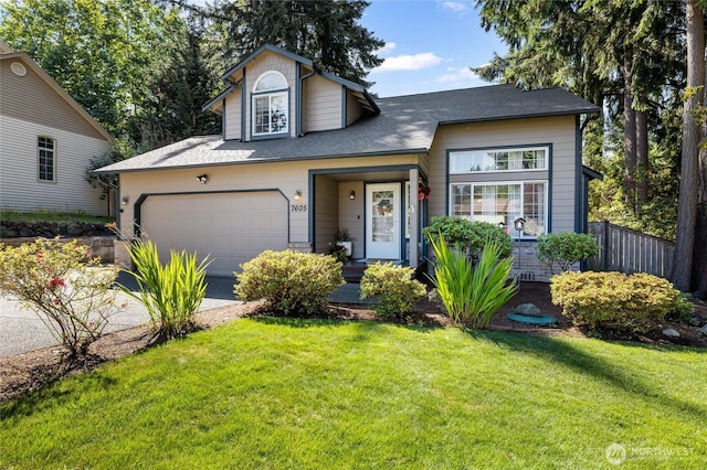 7605 38th Ct SE, Lacey, WA 98503 - traditional home featuring concrete driveway, a shingled roof, and an attached garage