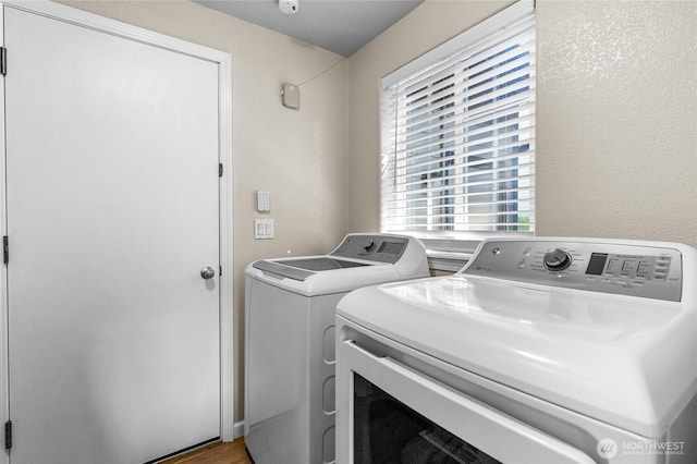 7605 38th Ct SE, Lacey, WA 98503 - laundry room featuring washing machine and clothes dryer and wood finished floors