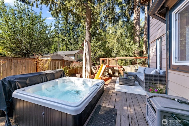 7605 38th Ct SE, Lacey, WA 98503 - deck featuring a hot tub and an outdoor hangout area