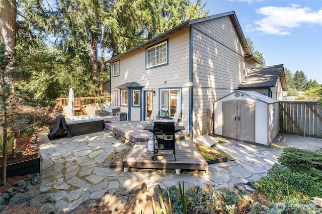 7605 38th Ct SE, Lacey, WA 98503 - rear view of property featuring a wooden deck, a shed, and a patio area