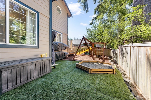 7605 38th Ct SE, Lacey, WA 98503 - fenced backyard with a playground and a vegetable garden