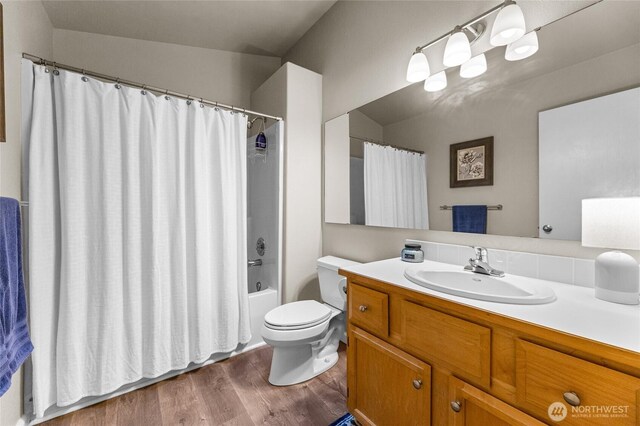 7605 38th Ct SE, Lacey, WA 98503 - full bathroom with vanity, wood finished floors, and shower / bathtub combination with curtain