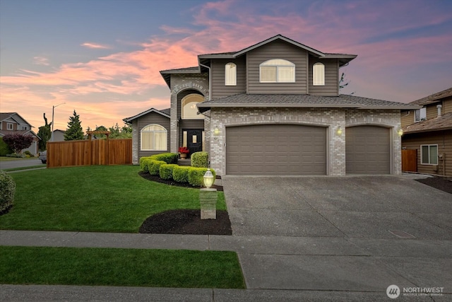 4212 145th Pl SE, Snohomish, WA 98296 - view of front of property with brick siding, concrete driveway, an attached garage, and a shingled roof