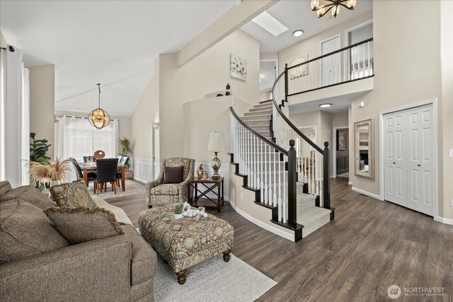 4212 145th Pl SE, Snohomish, WA 98296 - living room with a chandelier, high vaulted ceiling, stairs, and wood finished floors