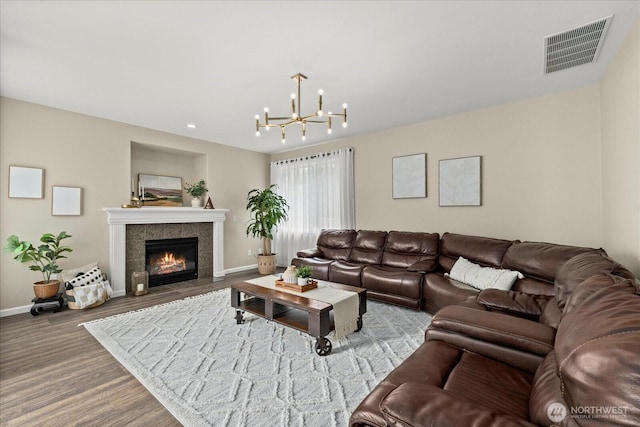 4212 145th Pl SE, Snohomish, WA 98296 - living area featuring wood finished floors, a chandelier, a tile fireplace, and recessed lighting
