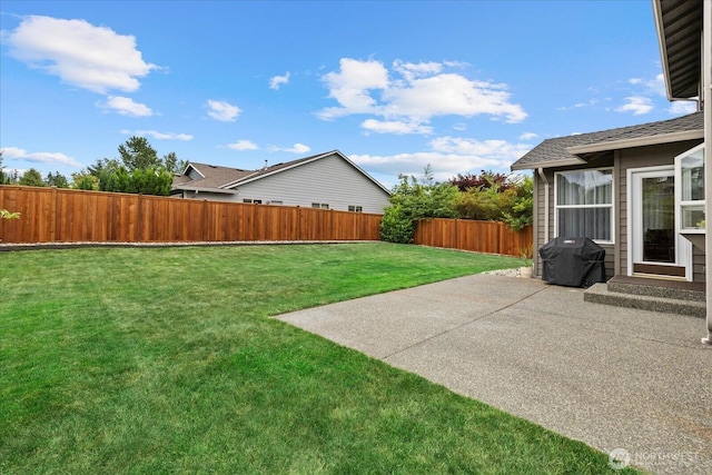 4212 145th Pl SE, Snohomish, WA 98296 - fenced backyard with a patio area
