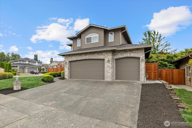4212 145th Pl SE, Snohomish, WA 98296 - view of front of house with concrete driveway, an attached garage, brick siding, and roof with shingles