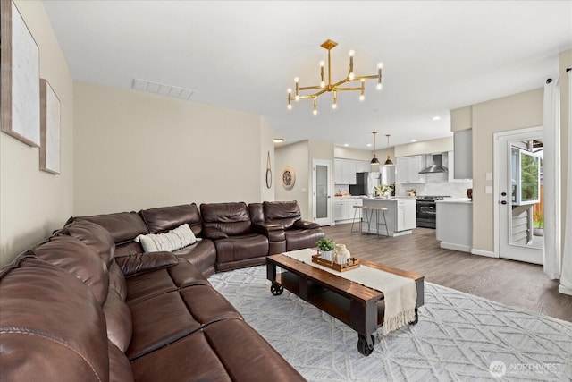 4212 145th Pl SE, Snohomish, WA 98296 - living room featuring a chandelier and light wood finished floors